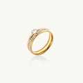 Gold-plated double-band ring with center rhinestone solitaire and channel-set stones on white background