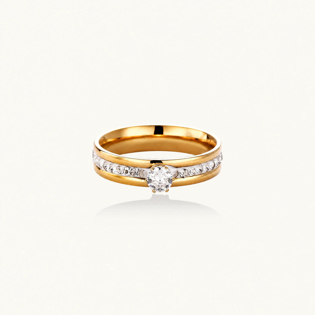 Gold-plated double-band ring with center rhinestone solitaire and channel-set stones on white background