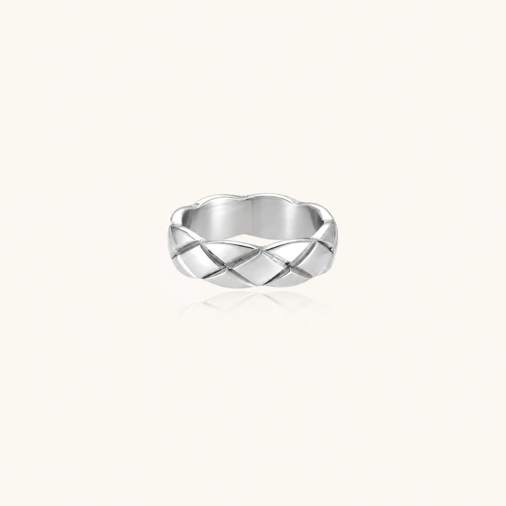 Braided stainless steel band ring with geometric interwoven strands in brushed silver finish on white background