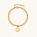 18K gold-plated oval bead bracelet with a four-leaf clover charm in mother-of-pearl or black enamel, adjustable lobster clasp, on white background.
