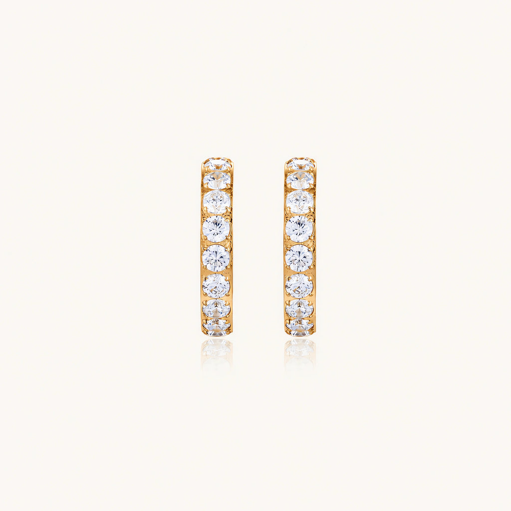 Gold pavé hoop earrings with two freshwater pearls nestled inside the curved design, featuring crystal-studded outer edge.