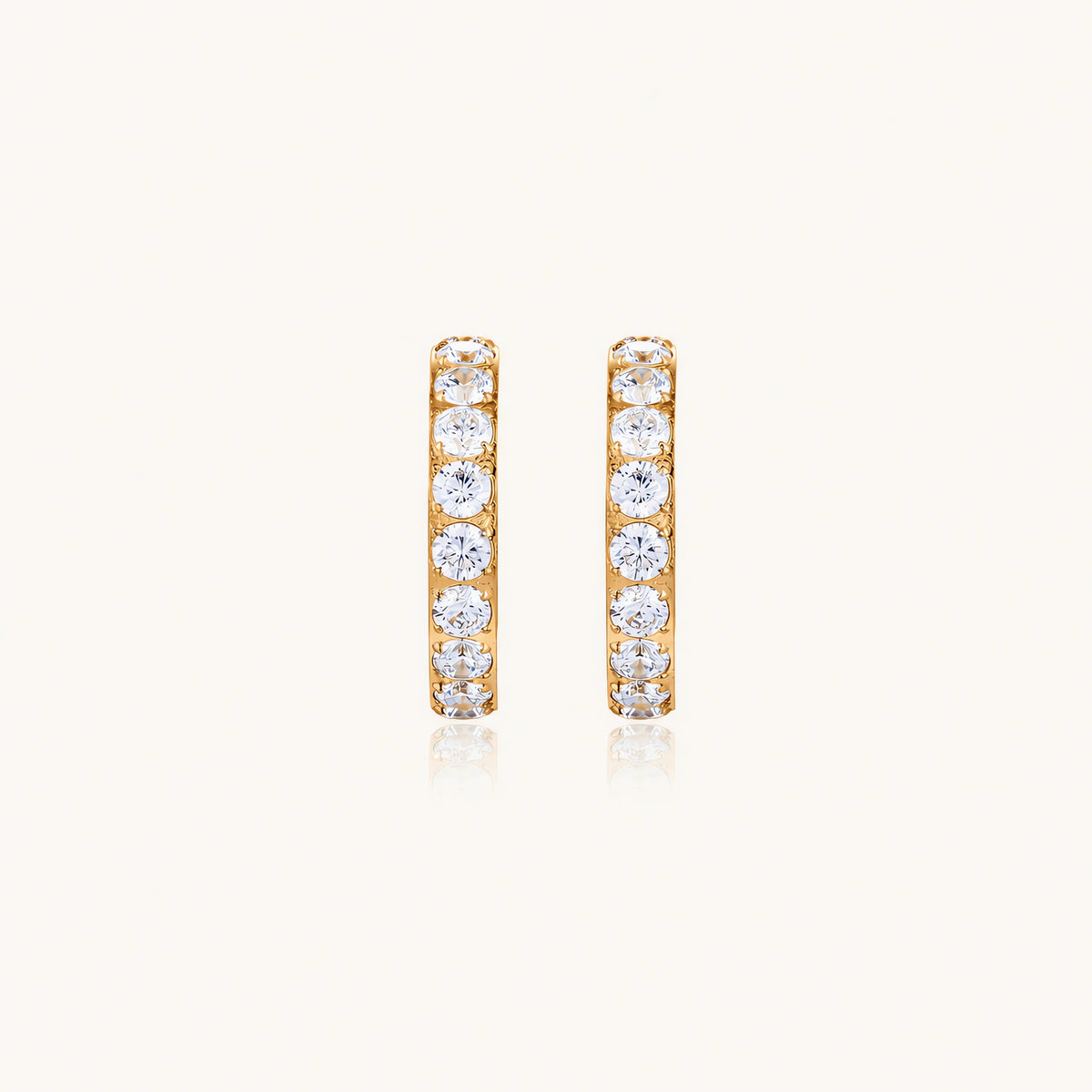 Gold pavé hoop earrings with two freshwater pearls nestled inside the curved design, featuring crystal-studded outer edge.